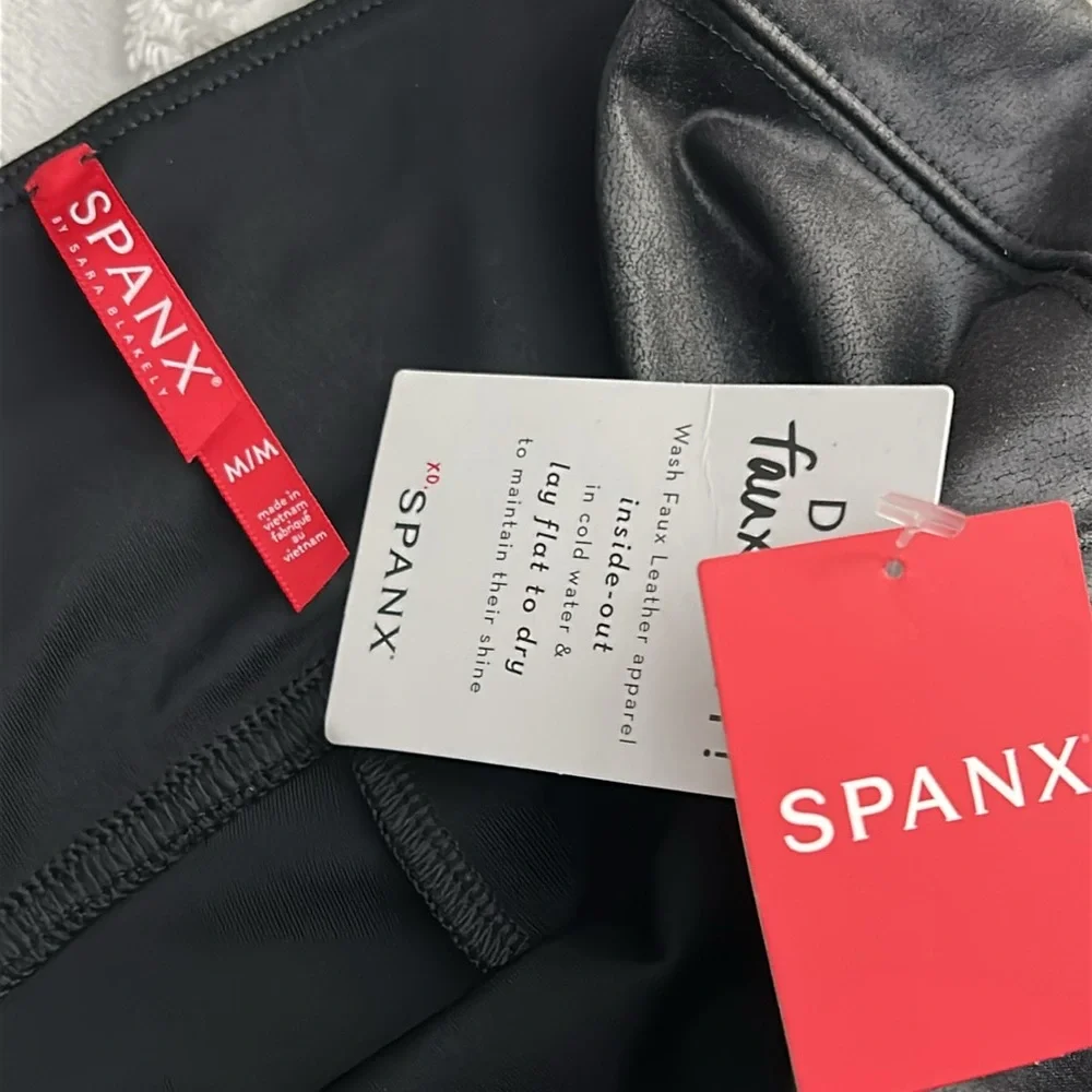 NWT Spanx black leather faux leggings, women’s size medium.